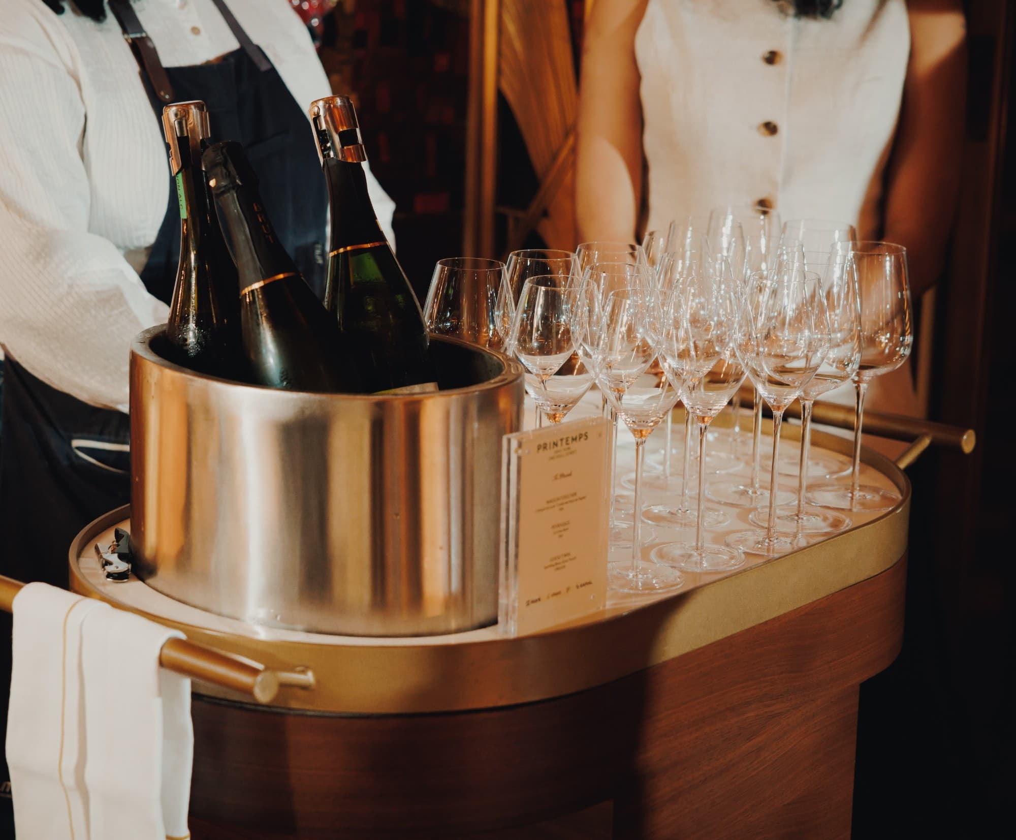 Champagne service at a Chord community event, hosted with Printemps