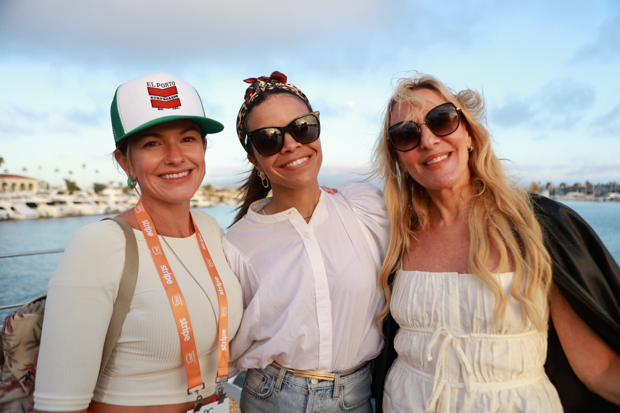 Guests smiling on a harbor cruise at a Chord community event